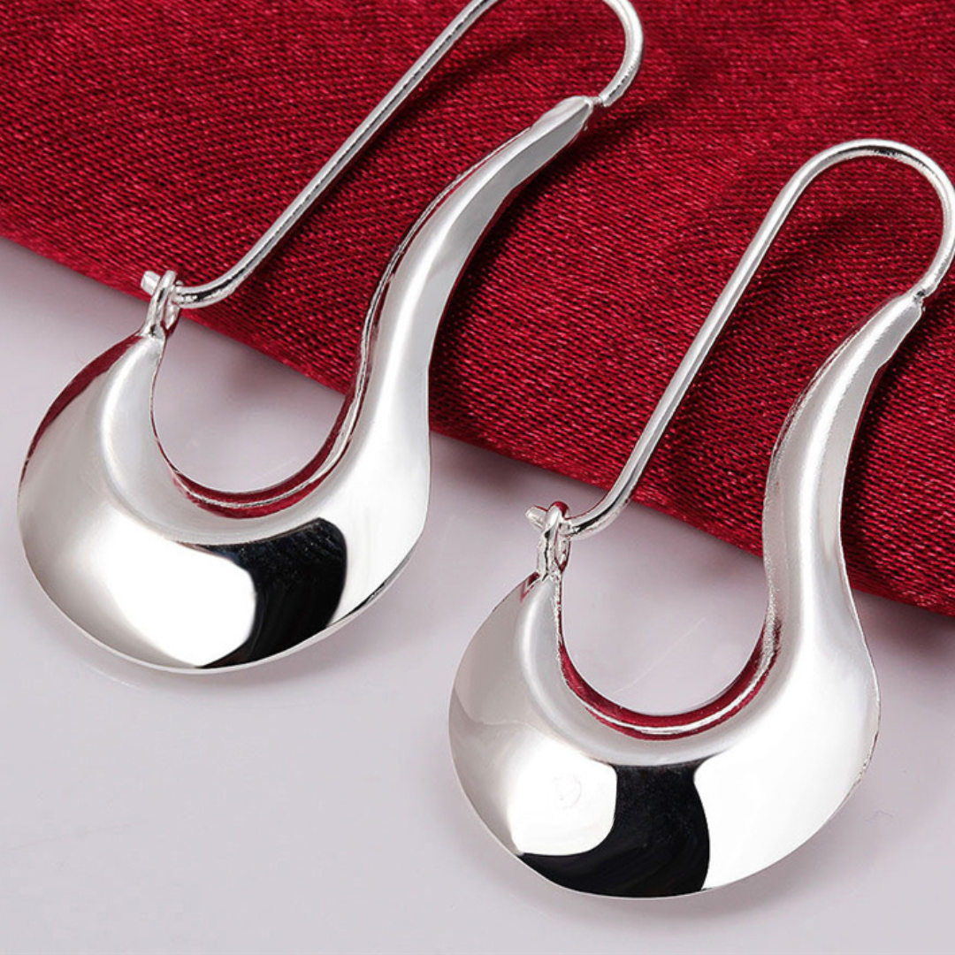 Boucles d'oreilles argentées de style moderniste