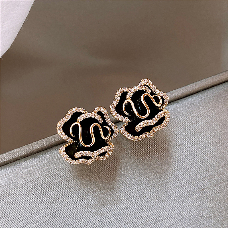 Boucles d'oreilles Lotus noires élégantes en or