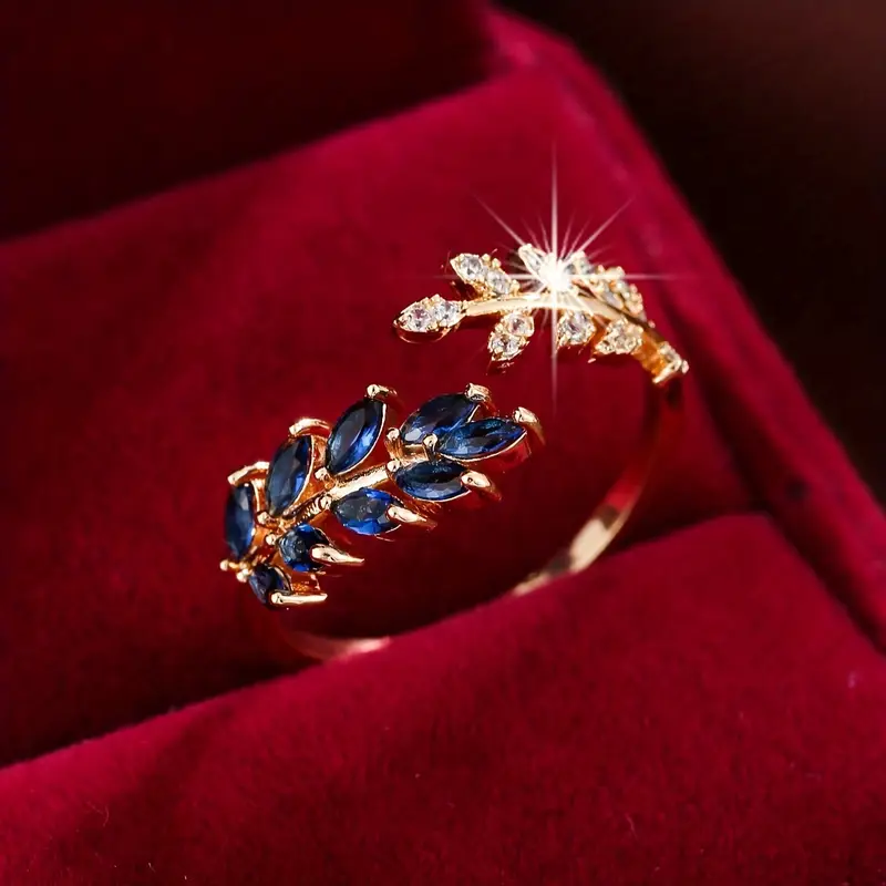 Bague finition or avec zirconium bleu ouvert