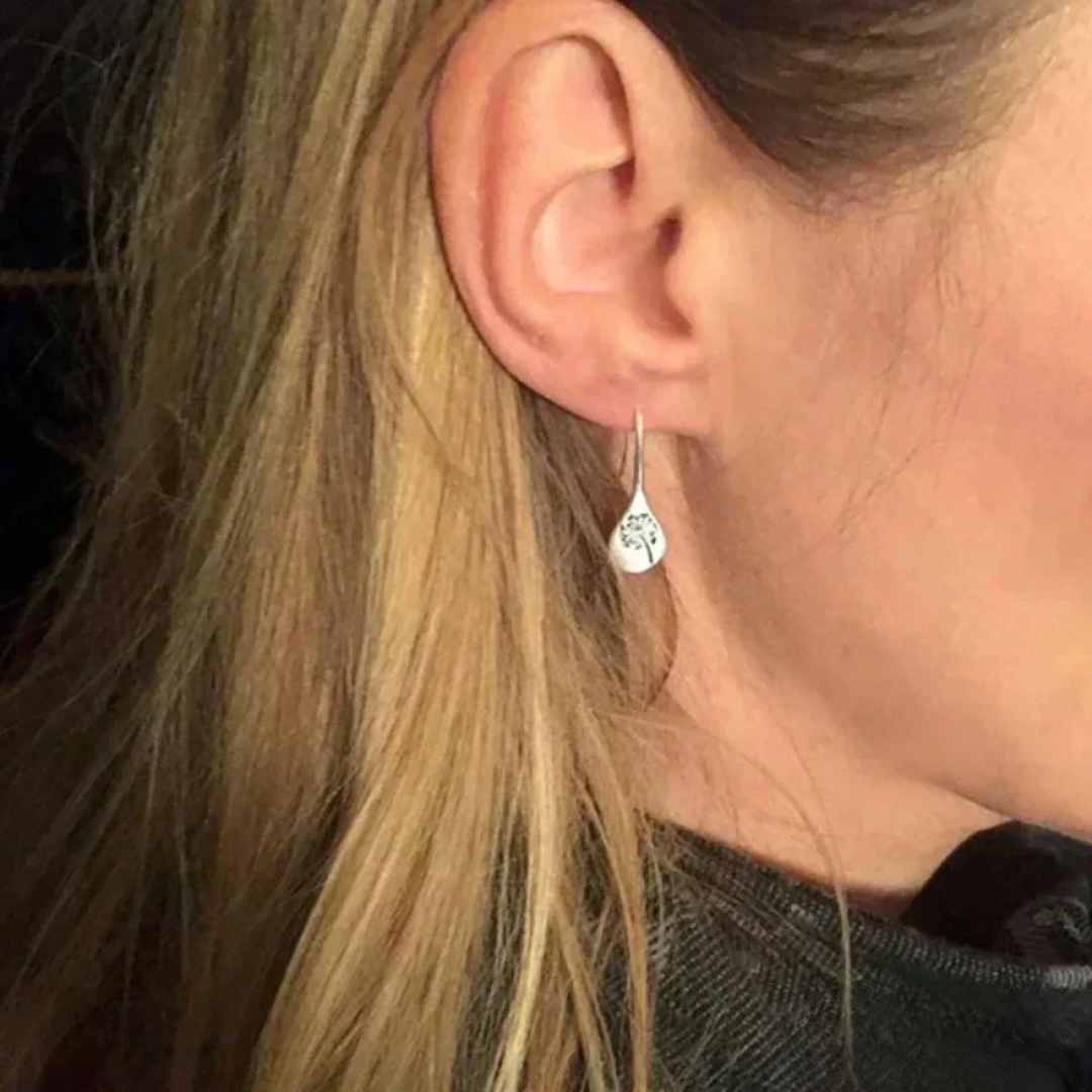 Boucles d'oreilles en argent finement travaillées en forme de feuille de pissenlit