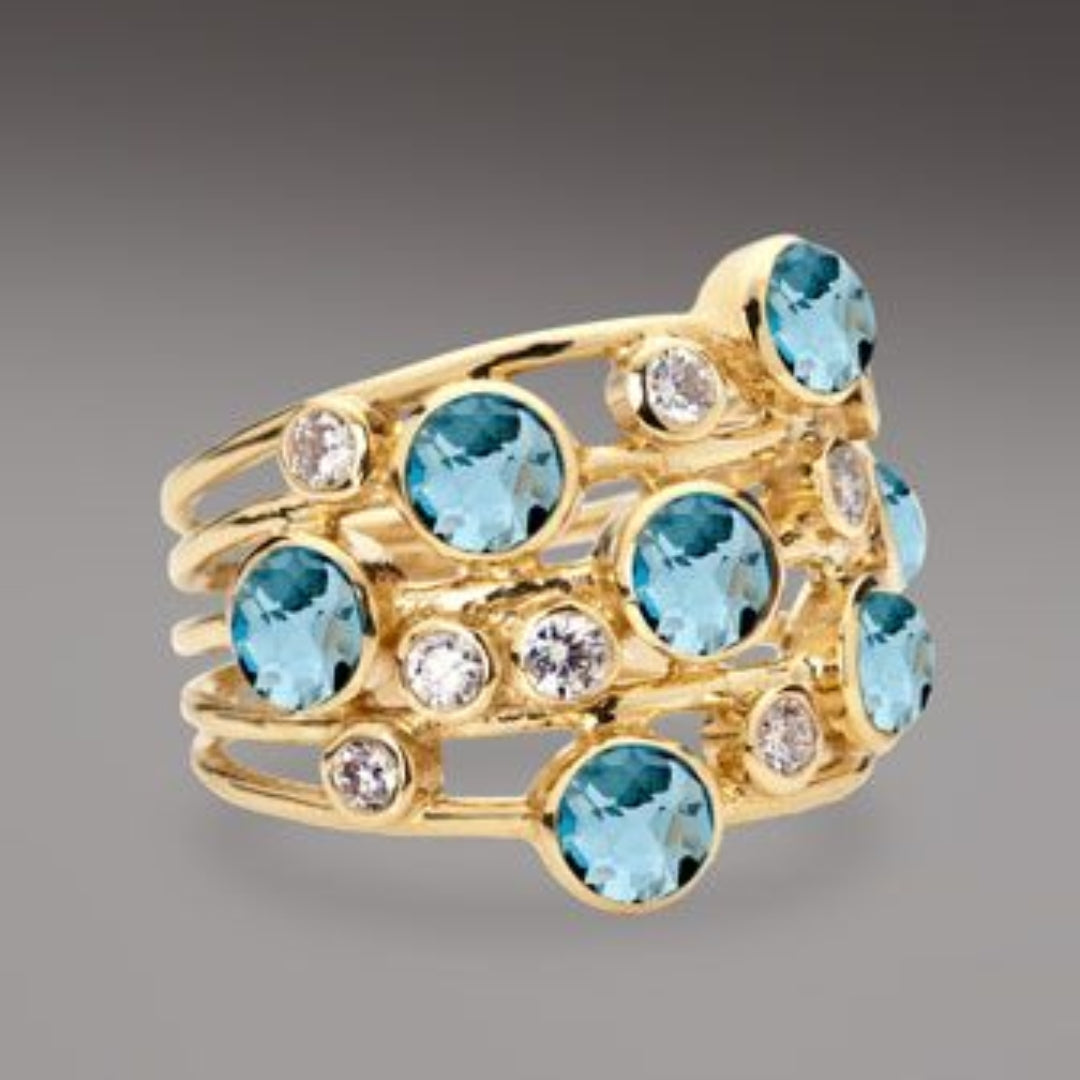 Bague vintage Goldring avec de nombreux zirconias bleus et blancs
